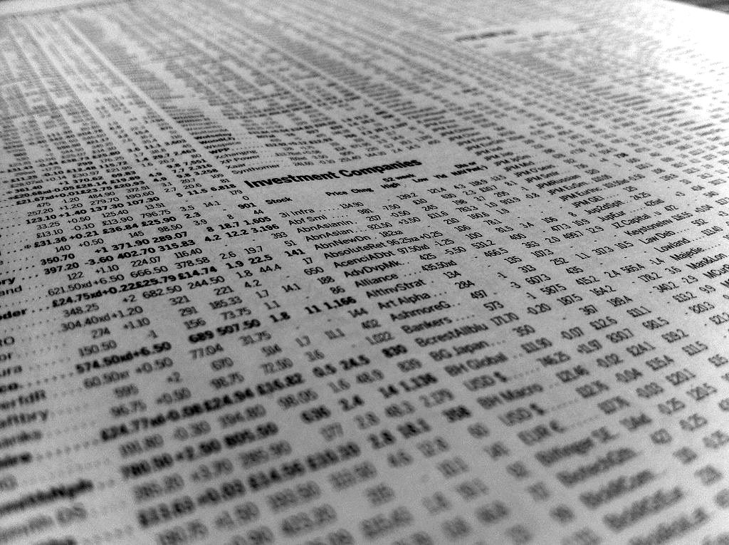 Columns of stock prices on a newspaper financial page