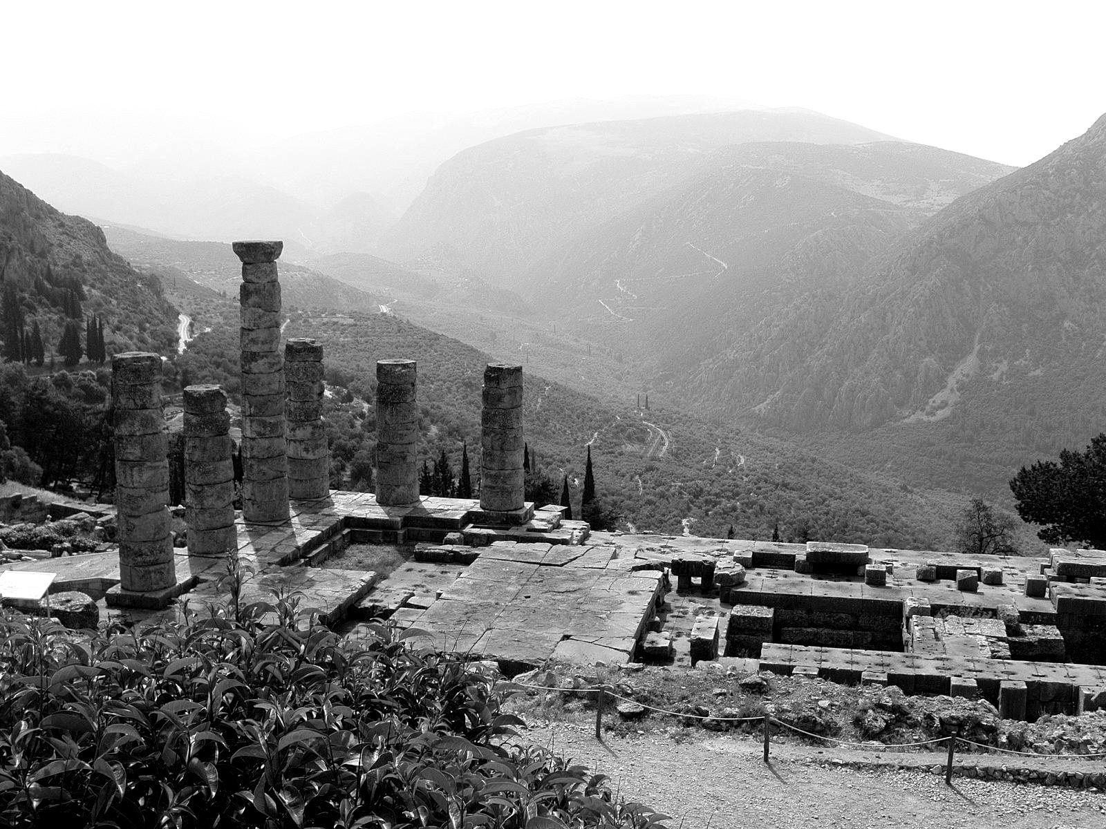 Ruins of the Temple of Apollo at Delphi with mountains behind