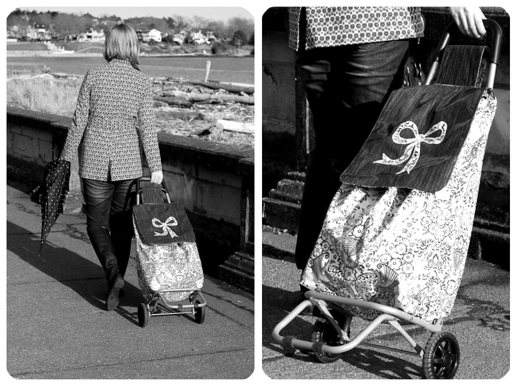 A shopper pulling a wheeled shopping trolley bag