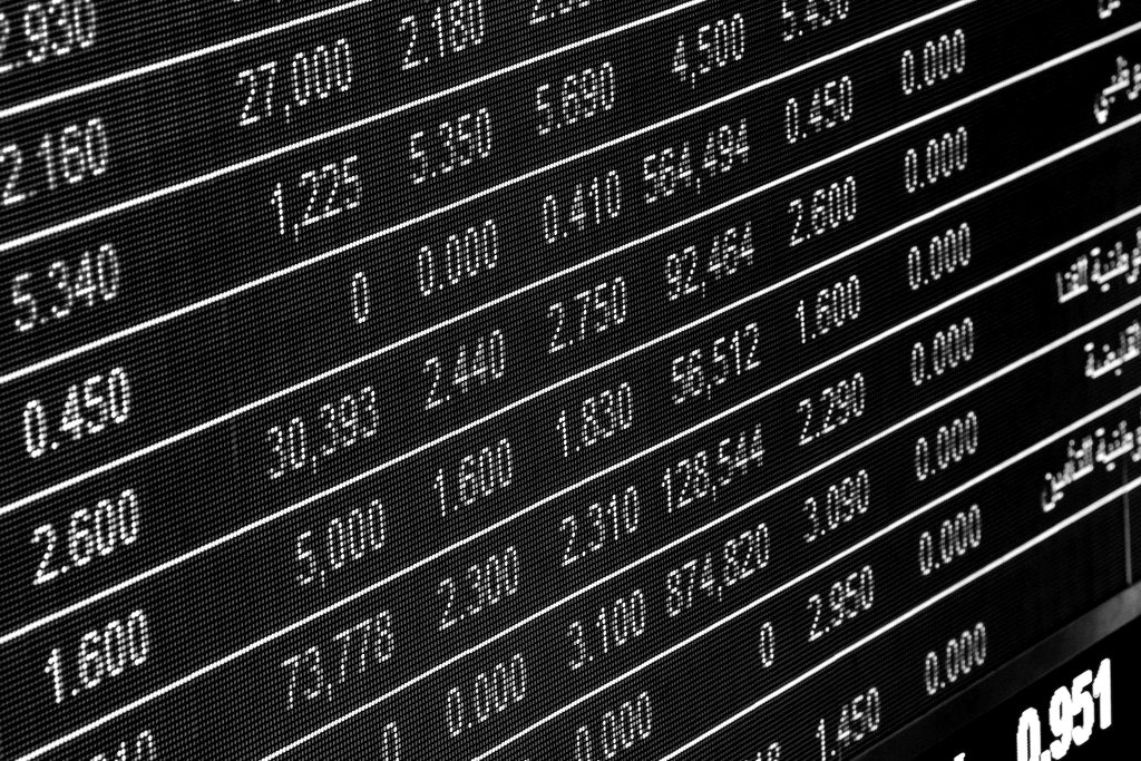 An electronic stock board showing rows of share prices