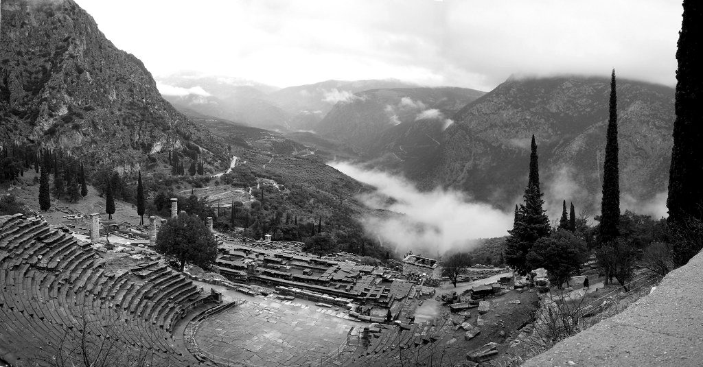 The ancient theatre of Delphi above a misty valley