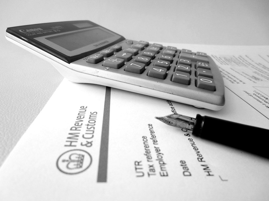 A calculator and fountain pen on an HM Revenue & Customs letter