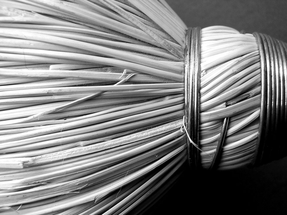 A tightly bound bundle of dry reeds
