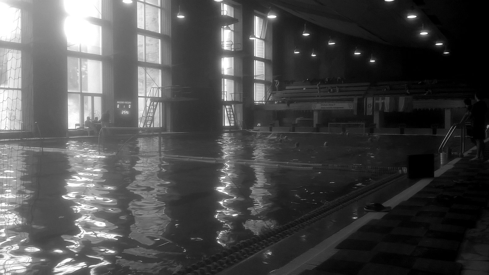 An indoor swimming pool hall in soft light