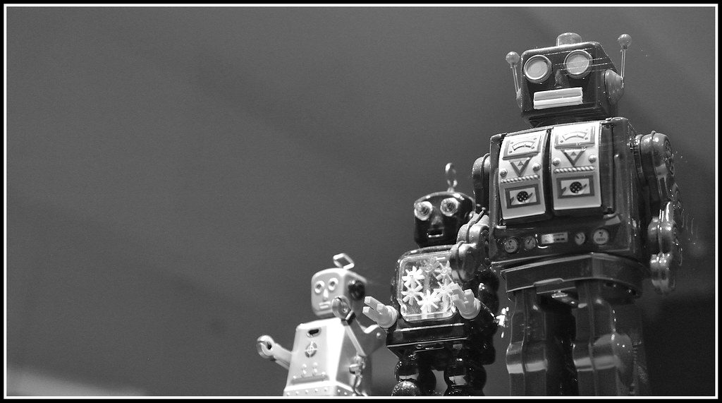 Vintage tin toy robots on a shelf